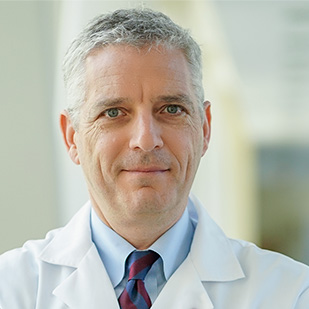 headshot of Dr. Bass, division chief