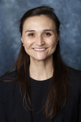 A headshot of Corinne Thorton